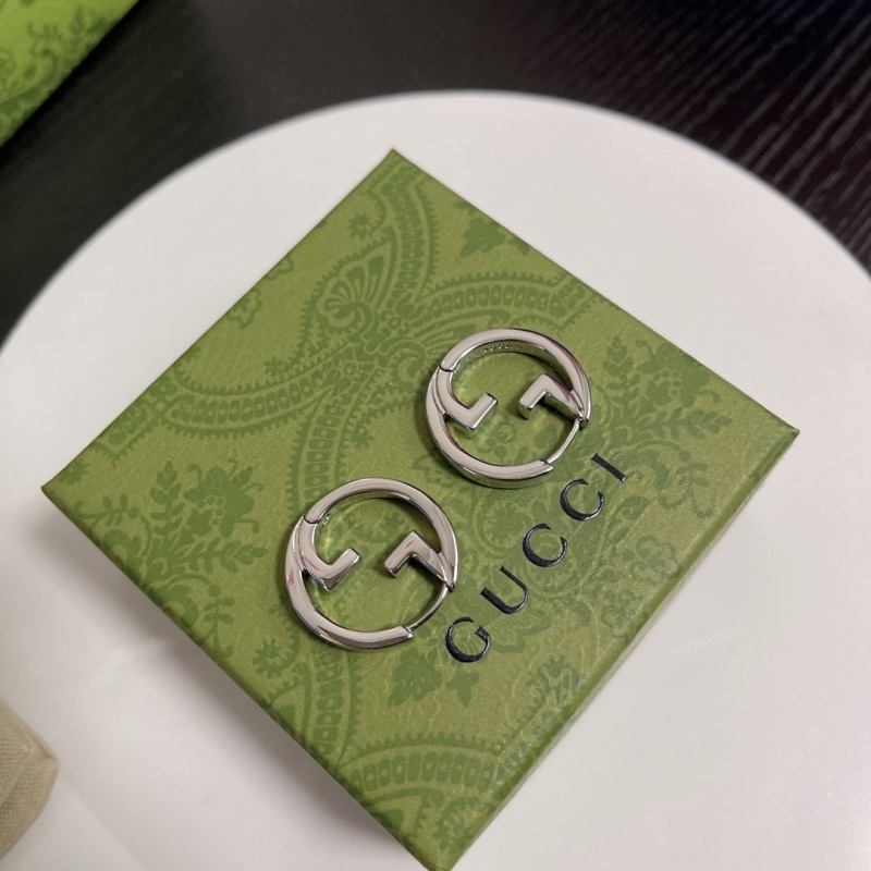 G*u*i earrings